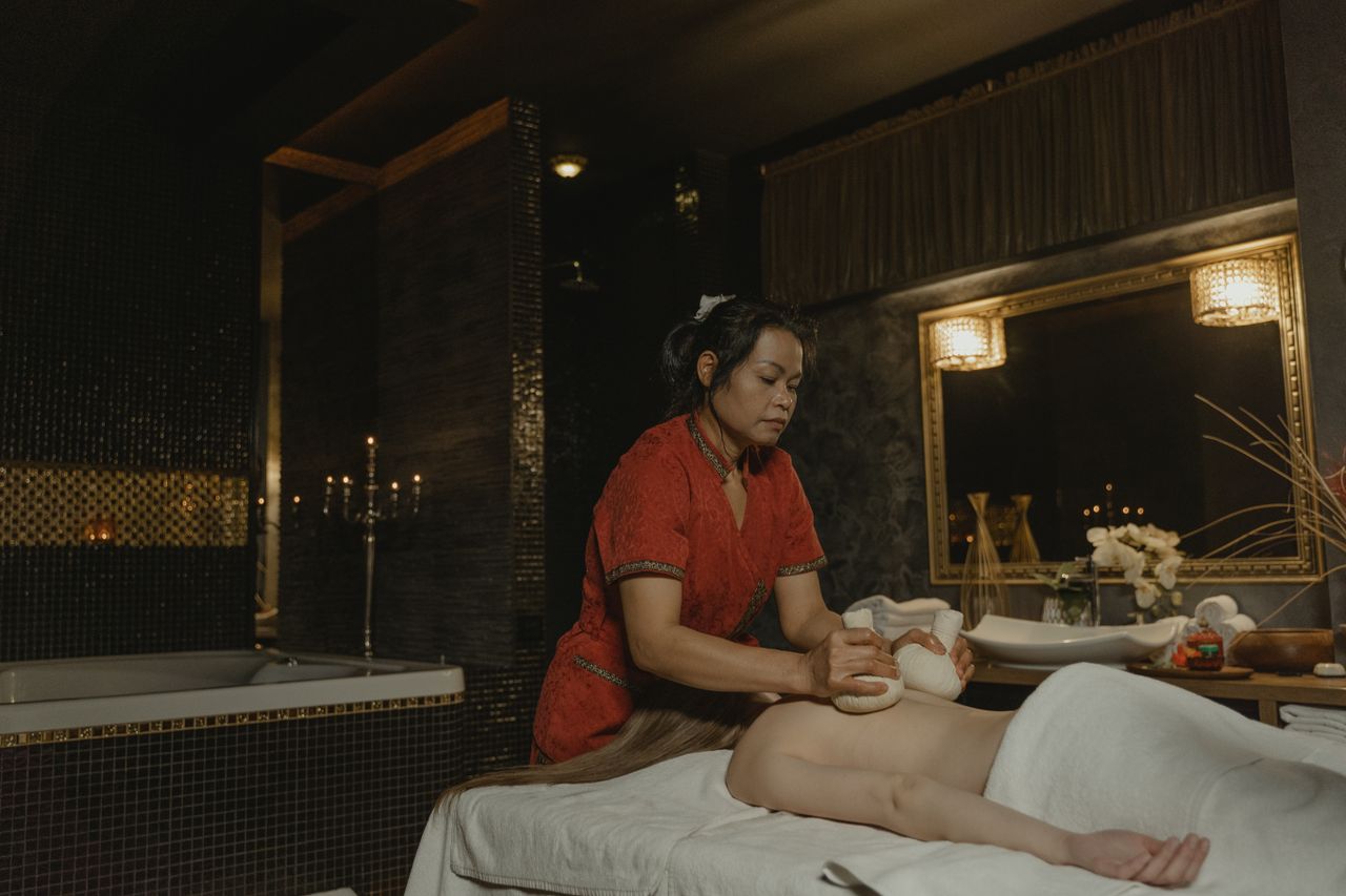A candlelit massage room at Auréa