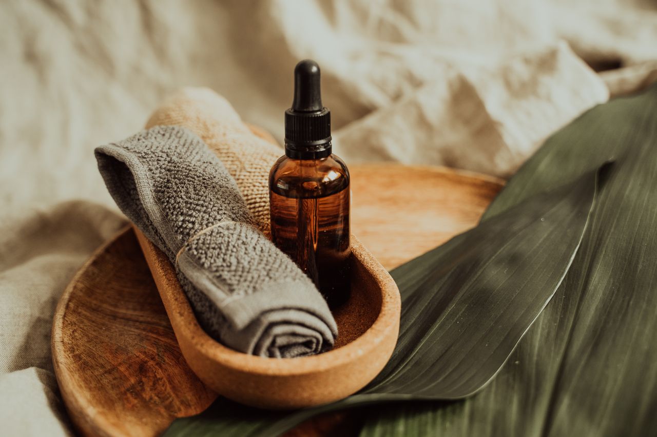 Essential oils, stones and towels arranged in a spa